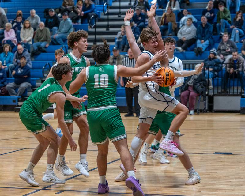 Kash Klendworth (10) of Fieldcrest drives ball down lane whilst being surrounded by Dwight's defense on Monday, December 15, 2025 at Fieldcrest High School in Minonk.