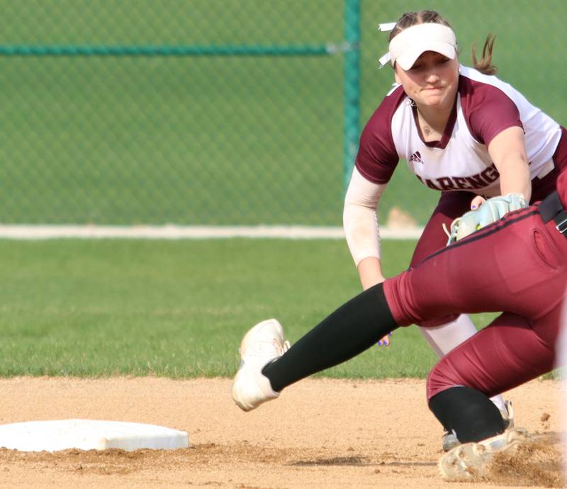 Richmond-Burton’s  Hailey Holtz is tagged out by Marengo’s Gabby Christopher at second base in varsity softball on Tuesday, April 22, 2025, at Marengo High School in Marengo. Holtz was out trying to stretch a single.
