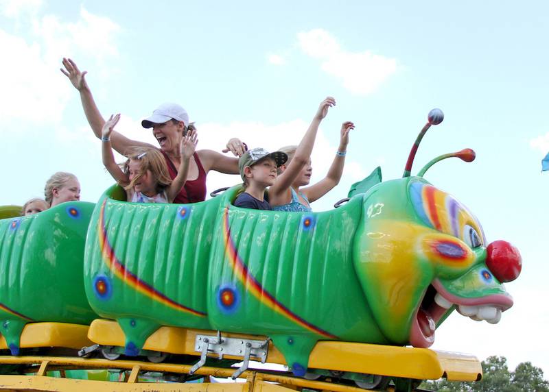 James Kopin, 7, of Channahon rode carnival rides with his family and friends Wednesday at a special event held at Three Rivers Festival geared for people with special needs.