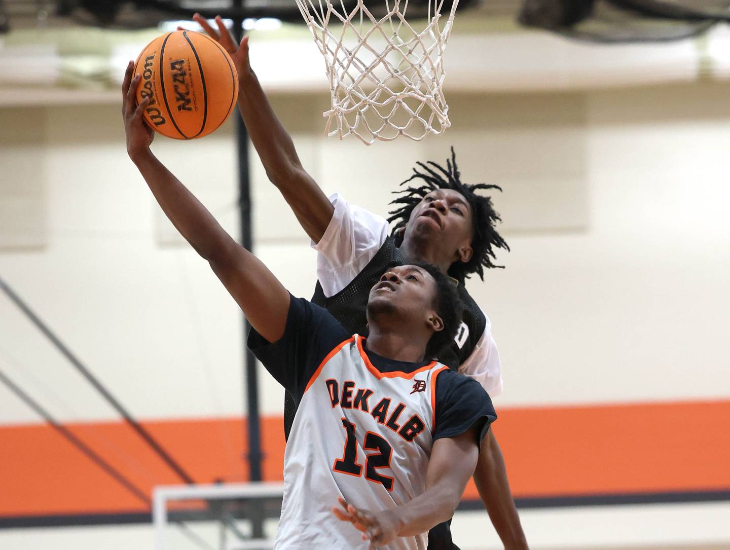 DeKalb’s Derrion Straughter gets to the basket ahead of a defender Friday, June 20, 2025, during their game against Streamwood in the DeKalb Live summer tournament at DeKalb High School.
