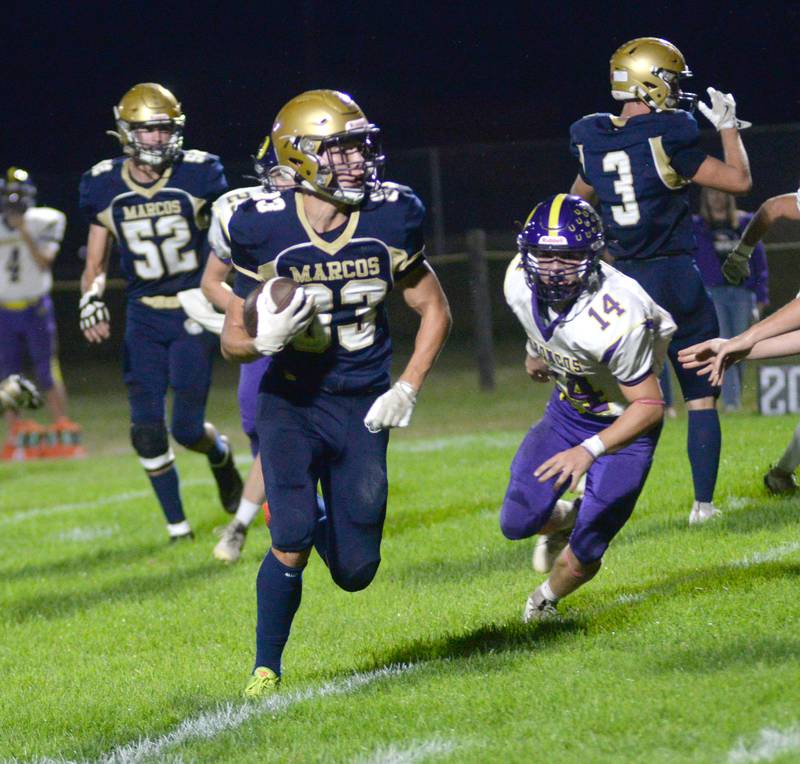 Polo's Mercer Mumford (83) heads to the end zone as Orangeville's Hayden Schofield follows during 8-man action at Polo High School on Friday, Oct. 3, 2025