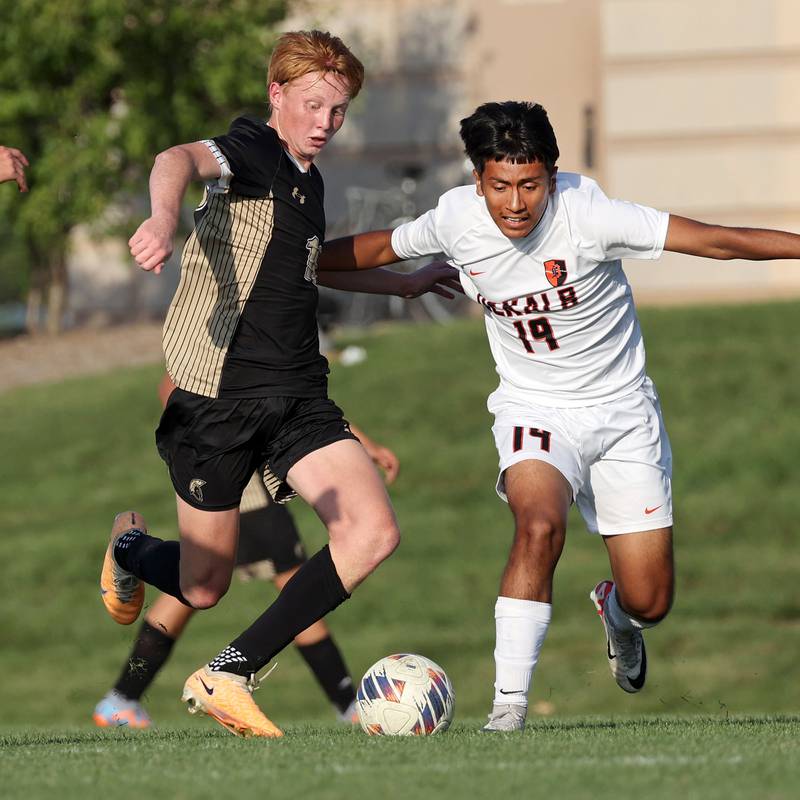 Sycamore's Jameson Carl (left) and DeKalb’s Christopher Alatorre go after the ball during their game Tuesday, Oct. 3, 2023, at Sycamore High School.