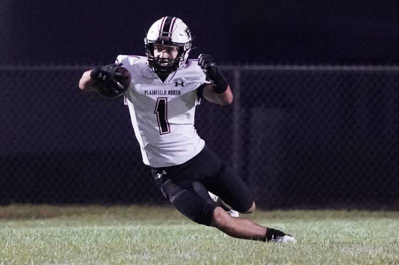 Plainfield North's Omar Coleman (1) returns a kick-off against Oswego during a football game at Oswego High School on Friday, Sept. 27, 2024.
