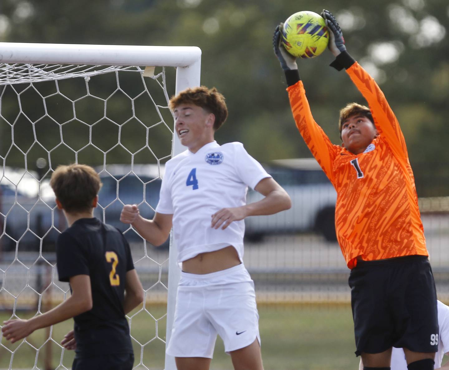 Woodstock's Luisangel Camacho (right) catches the ball during a Richmond-Burton corner kick during a Kishwaukee River Conference soccer match on Wednesday, Sept. 10, 2025, at Richmond-Burton High School, in Richmond.