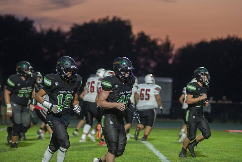 The Rock Falls Rockets come off the field after stopping an extra point attempt Friday, Sept. 2, 2022 against Stillman Valley.