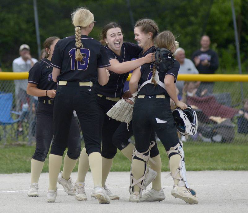 Serena’s Lady Huskers celebrate their win after the final out against Marquette Friday at Serena.