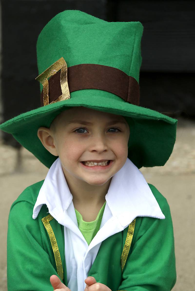 James Hursey , 5, watches the McHenry ShamROCKS the Fox Festival Parade on Saturday, March 16, 2024.