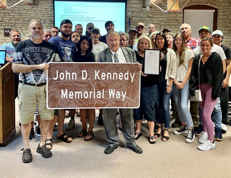 The Batavia City Council dedicated street signs honoring longtime city employee John Kennedy, who died in an off-duty accident in July, at the Aug. 15 City Council meeting.