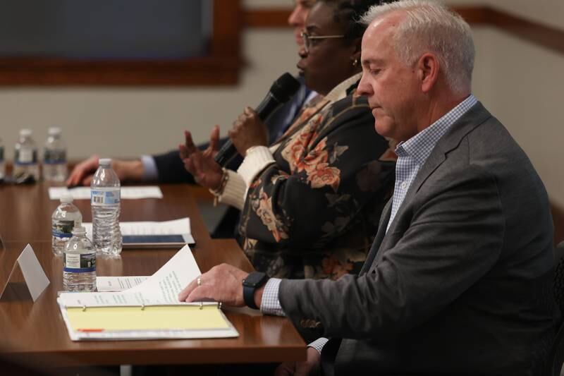 Joliet mayor candidate Terry D’Arcy looks over his notes at a forum for the candidates at the Joliet Public Library on Tuesday, March 28th, 2023 in Joliet.