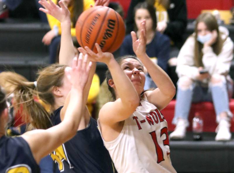 Indian Creek's Geena Sanford gets off a shot in front of a Polo defender during their Class 1A regional game Tuesday, Feb. 15, 2022, at Indian Creek High School in Shabbona.