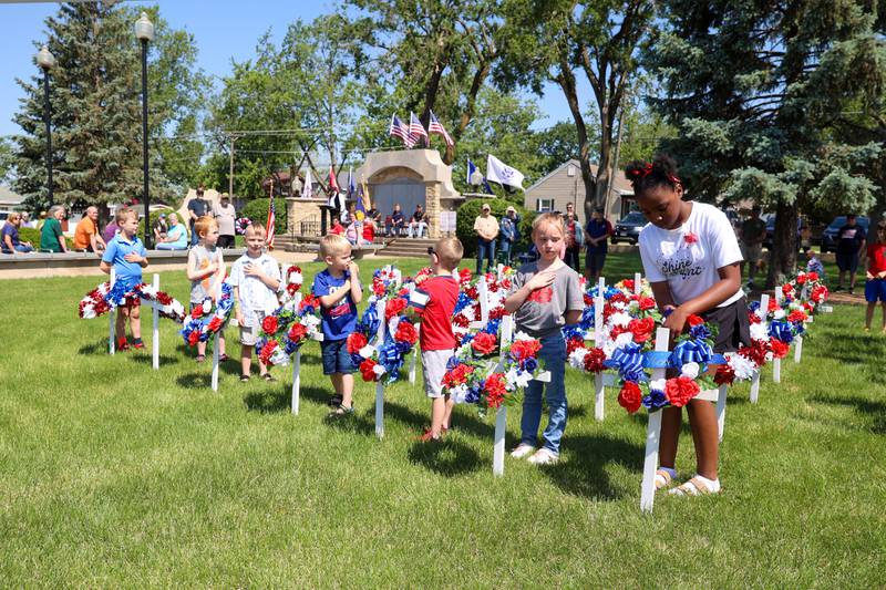 Children help place wreaths on crosses honoring fallen service members during the Bradley American Legion's Memorial Day ceremony on Monday, May 25, 2026.