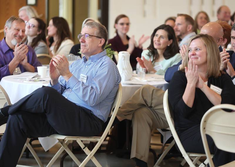 Attendees applaud an award recipient during the annual meeting of the Sycamore Chamber of Commerce Thursday, April 7, 2022, at St. Mary Memorial Hall in Sycamore.