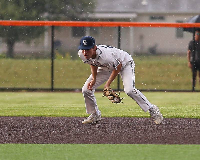 Oswego East's Mason Blanco (23) fields a grounder during Class 4A Romeoville Sectional semifinal between Oswego East at Downers Grove North.  May 31, 2023.