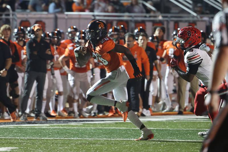 Lincoln-Way West’s Jahan Abubakar breaks away for the long touchdown run against Bolingbrook on Friday, Sept. 22 in New Lenox.