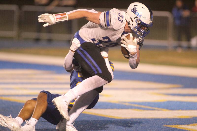 St. Charles North’s Jake Furtney scores a touchdown during a game at Wheaton North on Friday, Sept. 8, 2023.