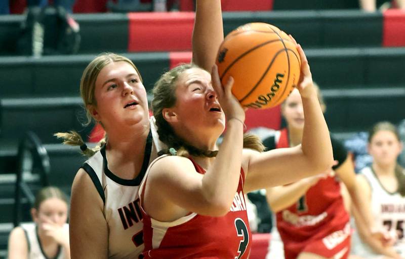 Aurora Christian’s Evelyn Klimek gets a shot up in front of Indian Creek's Madison Boehne during their game Monday, Nov. 25, 2024, at Indian Creek High School in Shabbona.