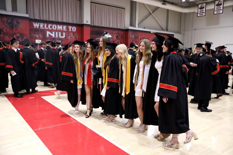 Batavia High School graduates pose for photos before the school’s 2023 commencement ceremony at Northern Illinois University in DeKalb on Wednesday, May 24, 2023.