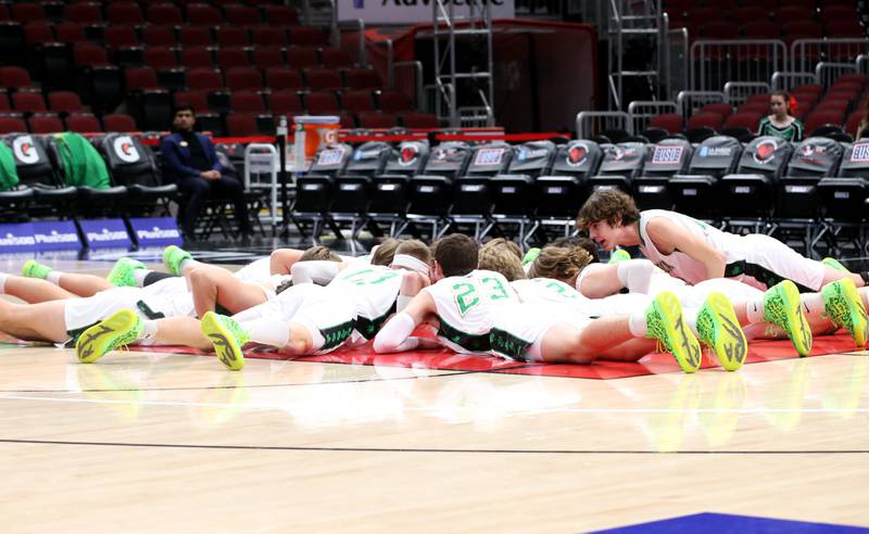Members of the Seneca boys basketball team perform their pre-game ritual before the game on Tuesday, Dec. 21, 2023 at the United Center in Chicago.