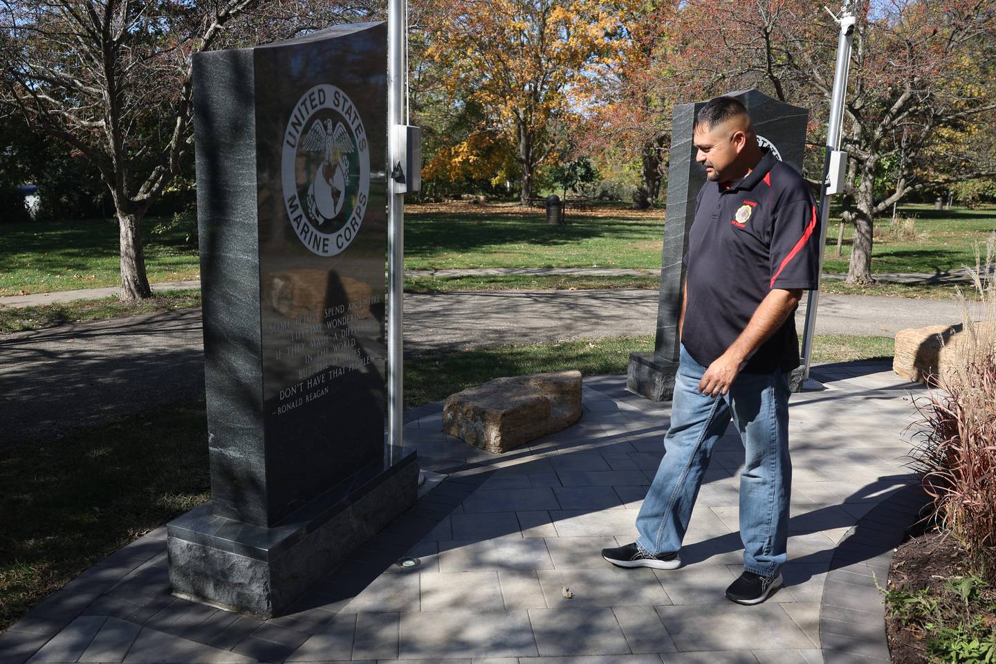 Hugo Gonzalez, a Marine Corps veteran, stands at the Marines Corps memorial at the  Forgotten Warrior Memorial in Channahon on Saturday, Oct. 19, 2024.