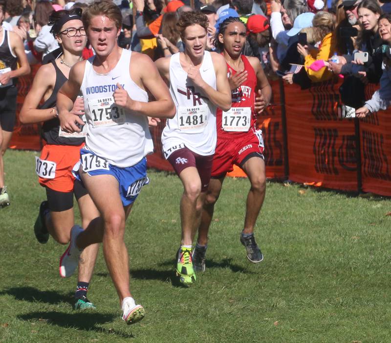 Woodstock's Jakob Crown and Prairie Ridge's Eddy Kilmkowski compete in the Class 2A State Cross Country race on Saturday, Nov. 4, 2023 at Detweiller Park in Peoria.