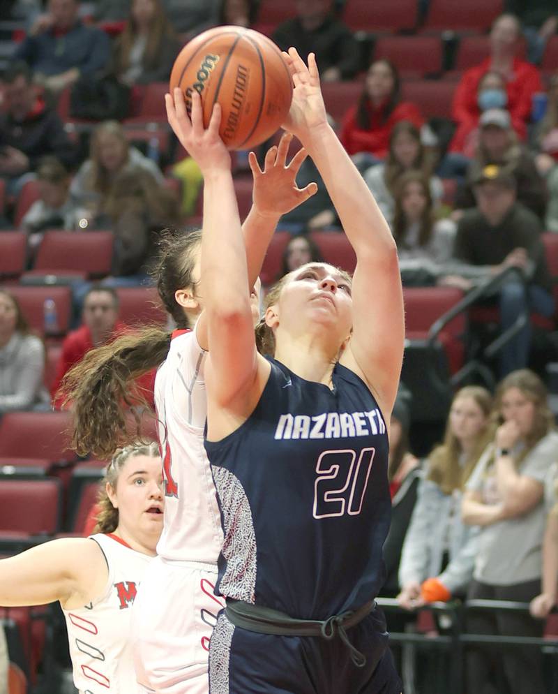 Nazareth's Olvia Austin gets to the basket in front of a Morton defender during their Class 3A state semifinal game Friday, March 4, 2022, in Redbird Arena at Illinois State University in Normal.