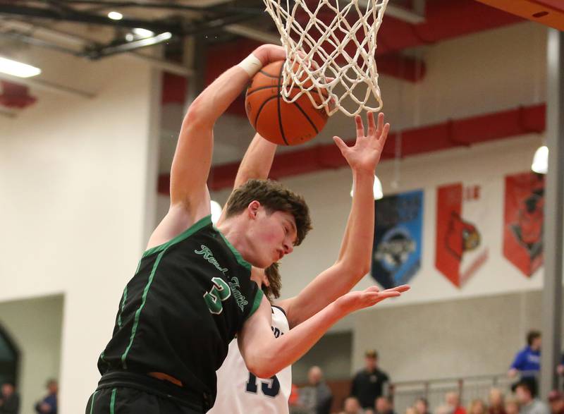 Rock Falls's Ryken Howard grabs a rebound over Fieldcrest's BRady Ruestman during the 49th annual Colmone Classic on Saturday, Dec. 9, 2023 at Hall High School.