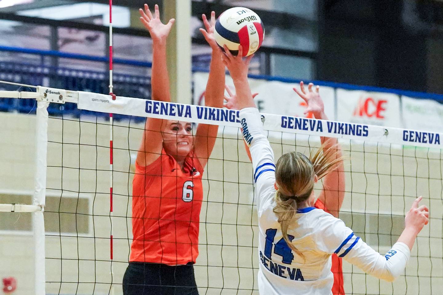 Wheaton Warrenville South's Mackenzie Hartman (6) defends the net against Geneva’s Evelyn Ross (14) during a DuKane Conference match in Geneva on Tuesday, Sept. 16, 2025.