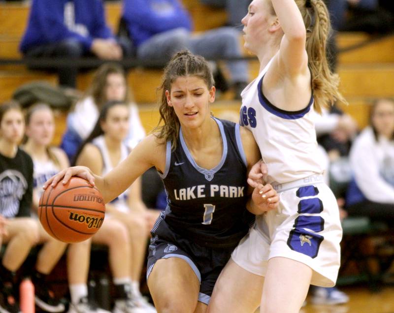 Lake Park’s Michela Barbanente (left) tries to get past Geneva’s Lauren Slagle during a Class 4A Glenbard West Sectional semifinal game in Glen Ellyn on Tuesday, Feb. 21, 2023.