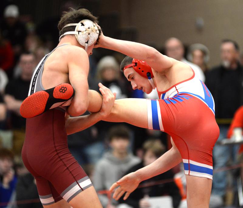 Oregon’s Nelson Benesh moves to escape Wheaton Academy’s Lincoln Hoger as they battle at 132 pounds at the 1A Oregon Sectional on Saturday, Feb. 15, 2025.