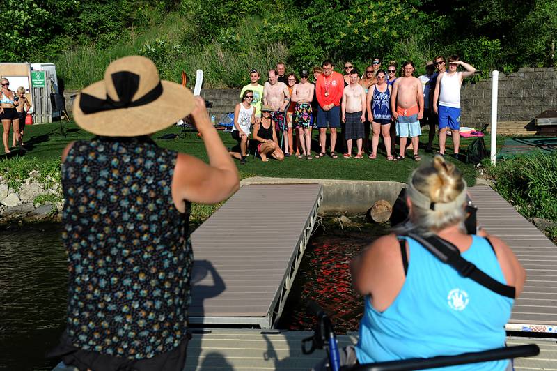 A team photograph is taken Tuesday, June 21, 2022, before the skiers take to the water for the Wonder Lake Water Ski Show Team and Northern Illinois Special Recreation Association’s performance on Wonder Lake. The performance was the end of the team’s learn to ski clinic. Members of ski team have constructed adaptive water ski equipment, which has proven year after year to be successful in allowing every participant to be able to water ski.