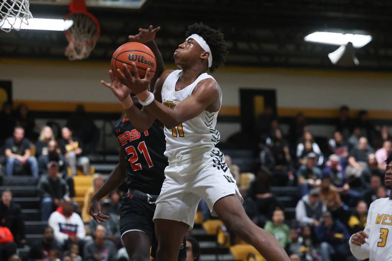 Joliet West’s Jeremy Fears goes in for the layup against Plainfield East.
