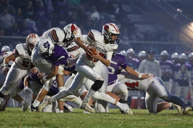 Stillman Valley’s Ryan Rueff rolls out of the pocket against Wilmington in the first round of the playoffs on Saturday, Nov. 2, 2024 in Wilmington.