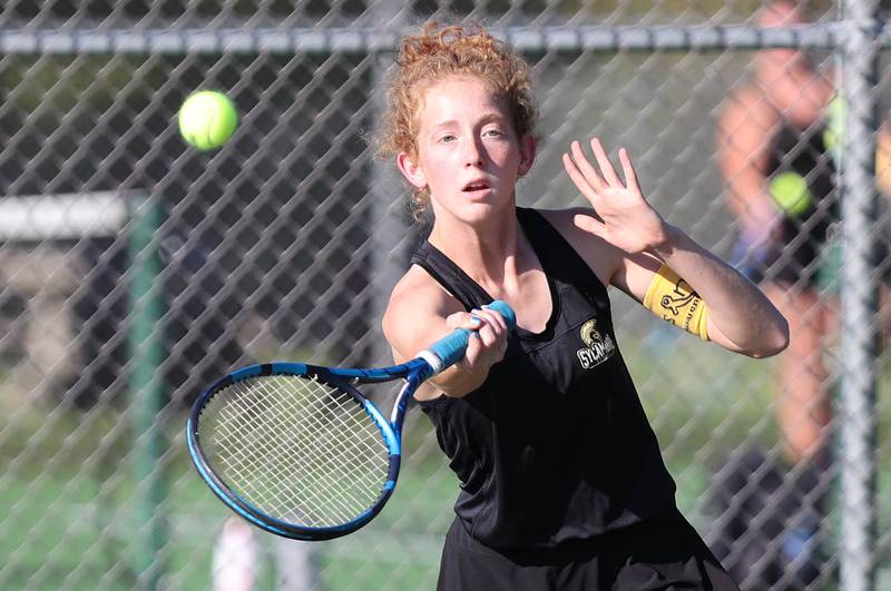 Sycamore's Jordyn Tilstra hits a forehand during her match against DeKalb's Nina Christopherson Monday, September 19, 2022, at Sycamore High School.
