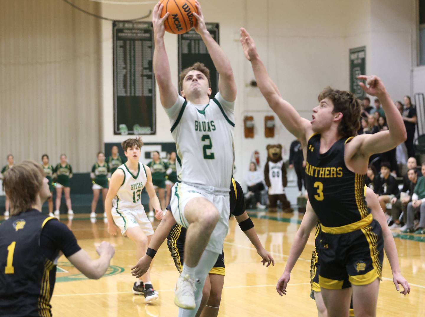 St. Bede's Gus Burr drives to the hoop to score over Putnam County's Johnathon Stunkel during the Class 1A Regional quarterfinal game on Monday, Feb. 23, 2026 at St. Bede Academy.