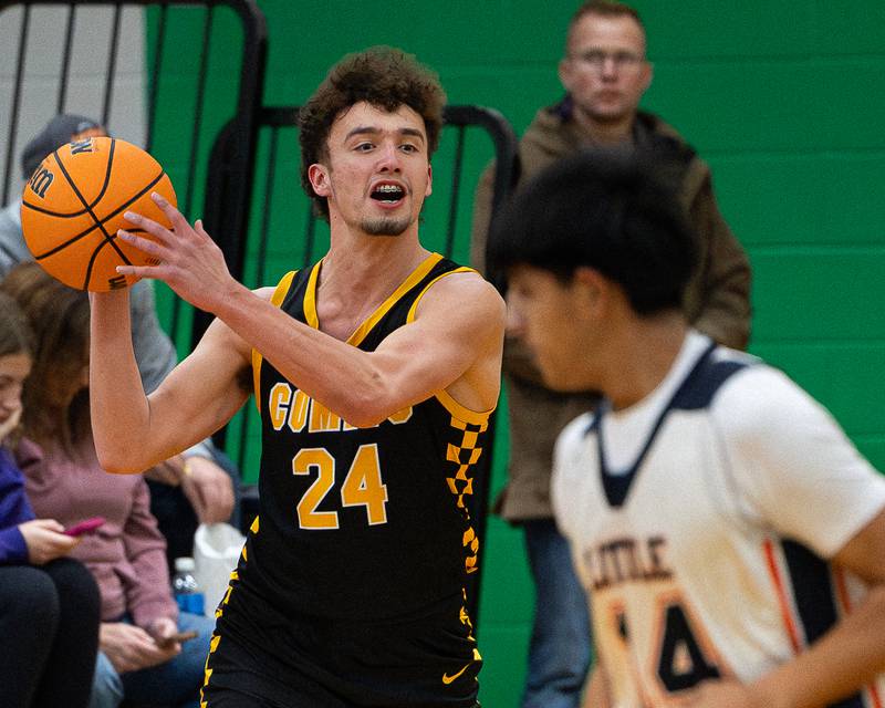 Colton Waldvogel (24) of Reed-Custer holds ball looking for pass during game against DePue in the Shipyard Showdown on Tuesday, December 23, 2025 at Seneca High School in Seneca.