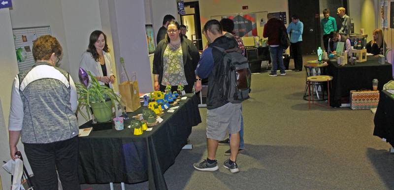 This photo from the MIMIC vault shows the annual Illinois Valley Community College MIMIC Fair draws audiences from on campus and off campus to see the latest practical, decorative, or creative product designs. This year, in keeping with A Night at the Museum theme, products from the fair’s history will be displayed.