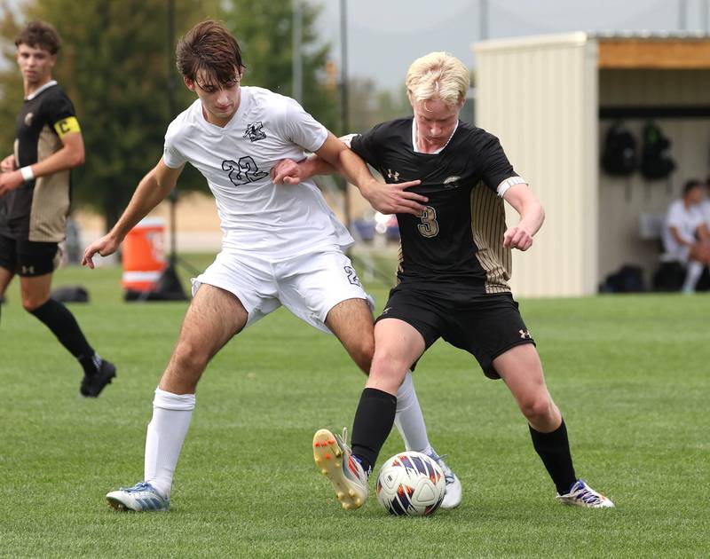 Kaneland's Carlos Landa (left) and Sycamore's Paxton Nicol fight for possession during their game Monday, Oct. 6, 2025, at Sycamore High School.