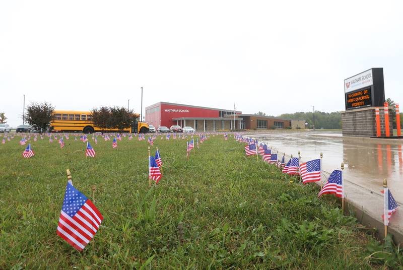 Waltham School placed 2,977 flags outside the school lawn to remember the lives lost in the 9/11 attacks on Monday, Sept. 11, 2023 in Utica.
