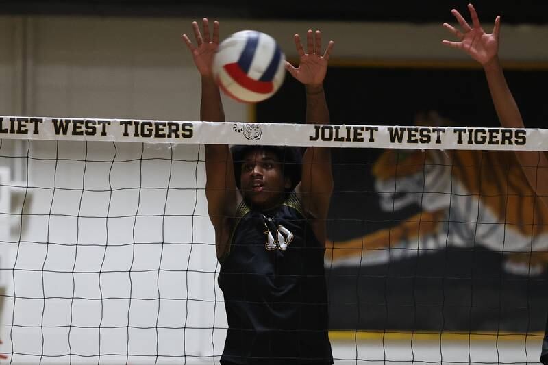Joliet West’s Adrian Paul goes for the block against Providence on Thursday, March 23, 2023 in Joliet.