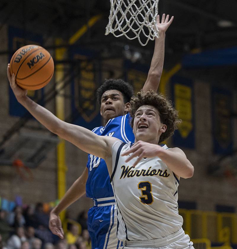 Sterling’s Brady Berlin goes strong to the hoop against Quincy Friday, Jan. 30, 2026.