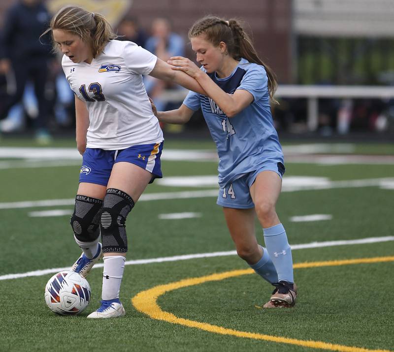 Johnsburg's Mackenzie McOuiston tries to get room to take a shot at goal as she is defended by Willows’ Julia Lechner during a IHSA Division 1 Richmond-Burton Sectional semifinal soccer match Tuesday, May 16, 2023, at Richmond-Burton High School.