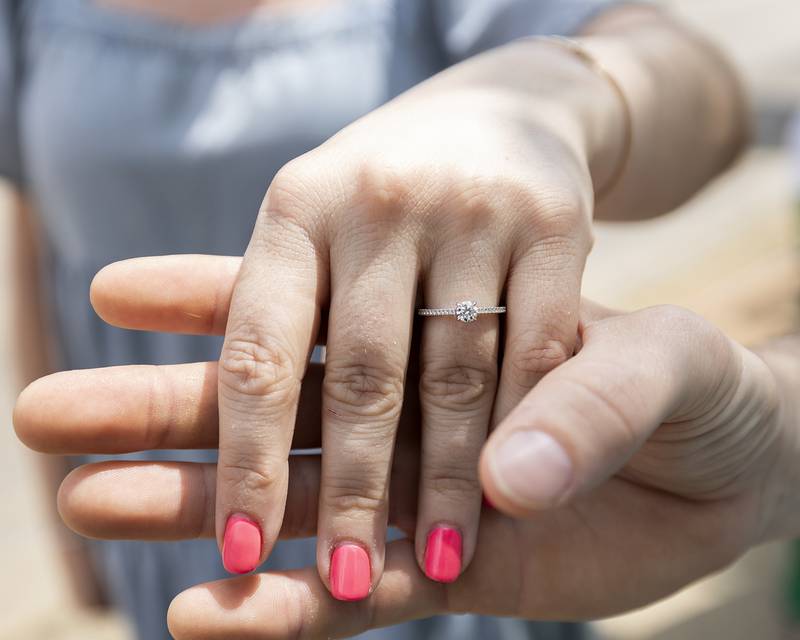 Walsh shows off her ring after the engagement Saturday, April 27, 2024. Riley had to strategically keep his hand in his pocket to hide the box while they walked to the arch.