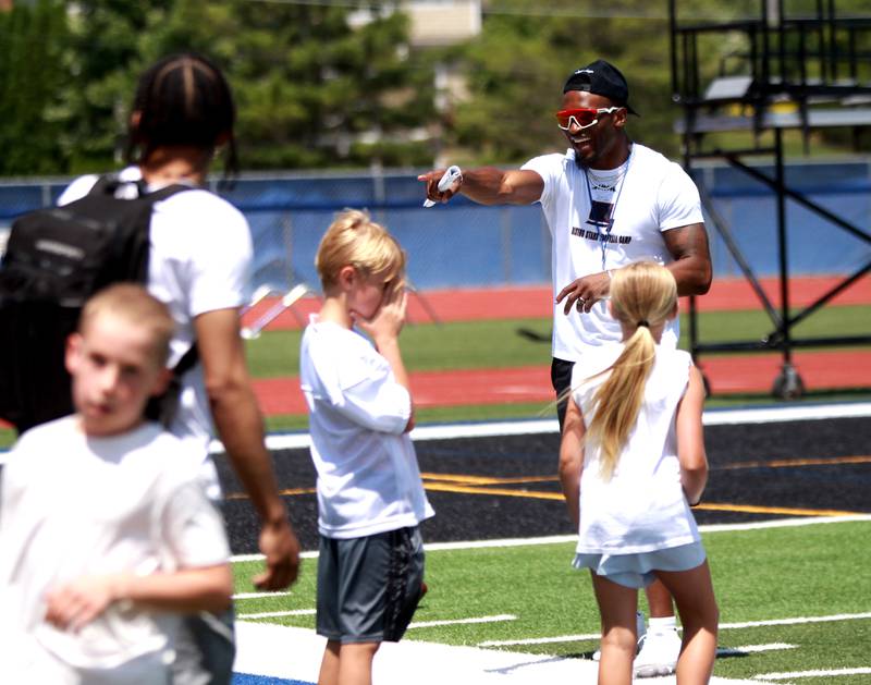 Former St. Charles North standout and current New York Giants defensive back Tyler Nubin works with young players on the first day of a three-day football camp on Friday, June 20, 2025 in St. Charles.