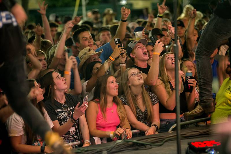 Music fans celebrate Friday night headliner Travis Denning July 1, 2022 at Dixon’s Petunia Fest. Lots more music to be heard on Saturday and Sunday at the festival.