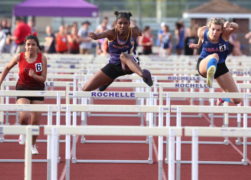 Mendota’s Mariyah Elam (center) competes in the 100 meter hurdles Wednesday, May 8, 2024, during the girls track Class 2A sectional at Rochelle High School. Hernandez qualified for state.