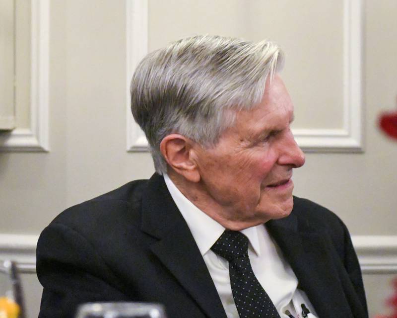 Harrison Schneider listens to his granddaughter Brianna Wynne speak about his accomplishments during the St. Charles Area Chamber of Commerce Charlemagne Awards dinner on Friday May 1, 2026.