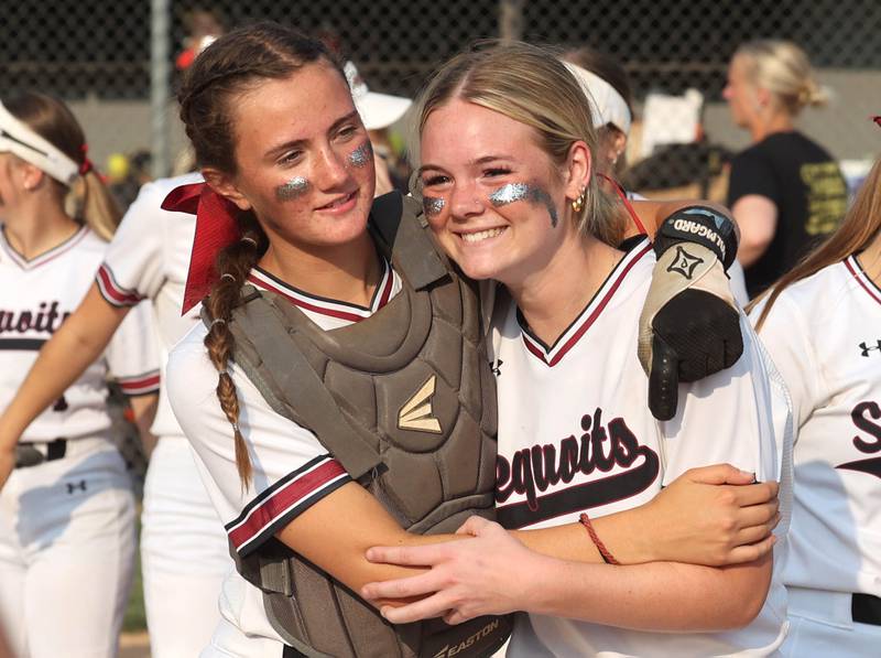 Antioch's Grace Green (left) and Jacey Schuler celebrate after their win in their Class 3A supersectional over Sycamore Monday, June 5, 2023, at Kaneland High School in Maple Park.