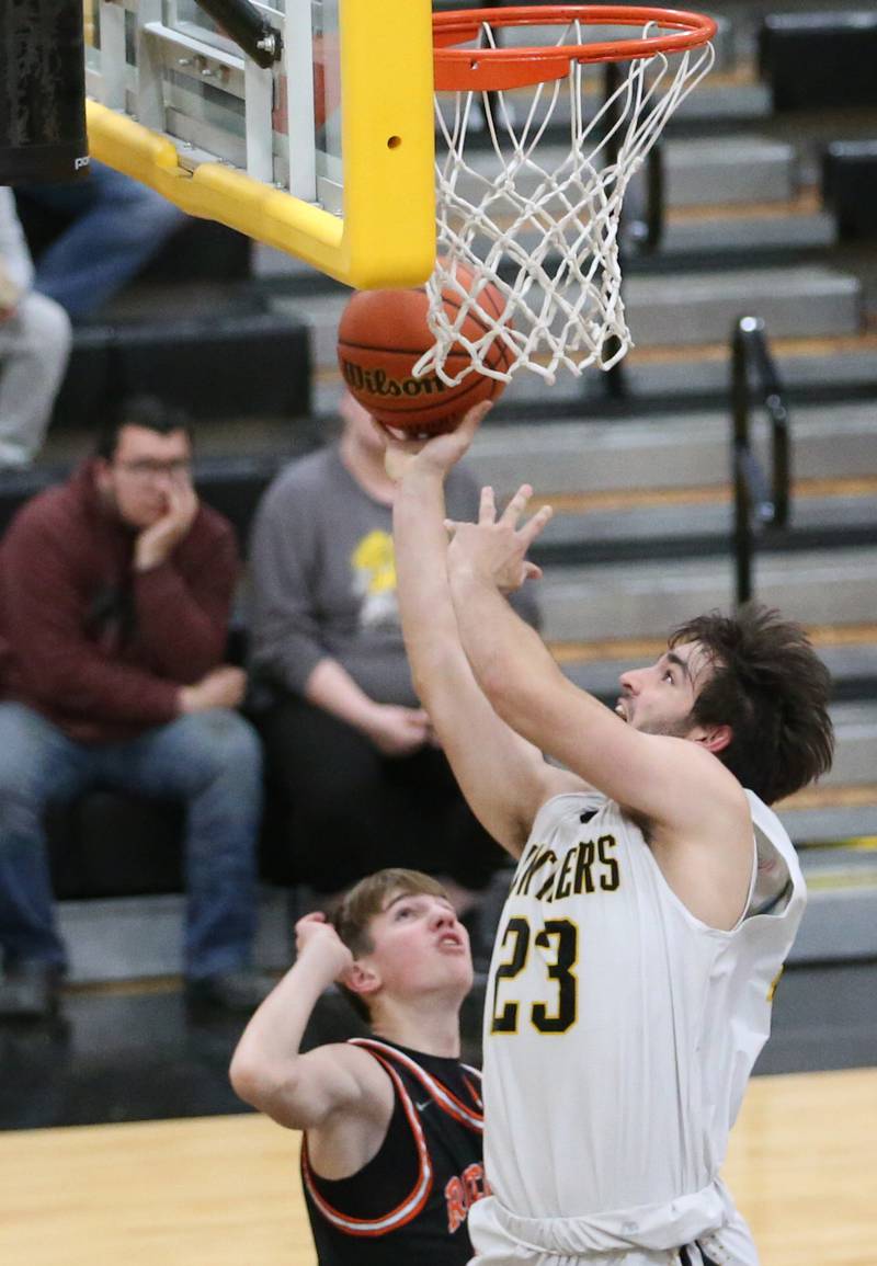 Putnam County's Jackson McDonald scores on a layup over Roanoke-Benson's Jude Zeller during the Tri-County Conference Tournament on Tuesday, Jan. 24, 2023 at Putnam County High School.