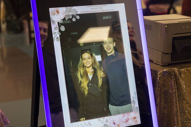 Jasmine Lloyd and Andrew Sparapani review their picture taken in a photo booth from Perfect Picture Memories on Sunday, Feb. 2, 2025, at the Sauk Valley Wedding Expo in Sterling.