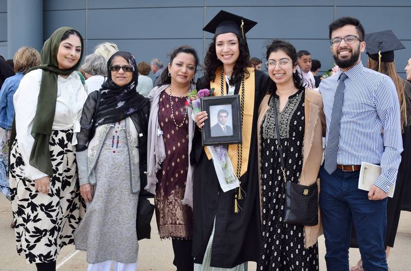 Sarah Siddiqui and her family pose for a photo together after the commencement ceremony for Sycamore High School's Class of 2022, held Sunday, May 22, 2022 at Northern Illinois University's Convocation Center in DeKalb.